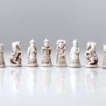 A group of chess pieces sitting on top of a table